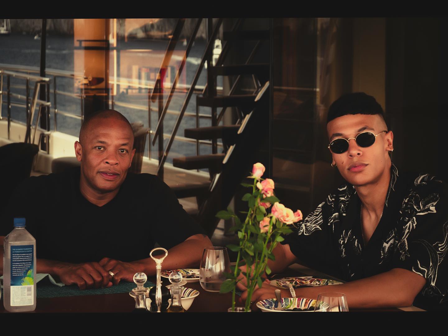 Truice Young with his father, Dr. Dre enjoying a meal together.